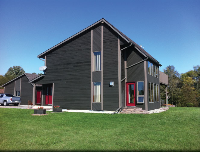 Side view of house & garage with new trough.