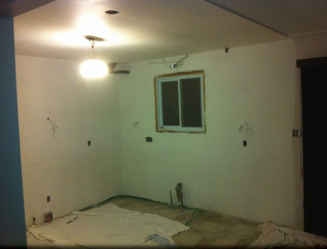 Wall between kitchen and dining room removed.  Walls and ceilings were made ready for new custom kitchen, paint and backsplash - Smithville, ON