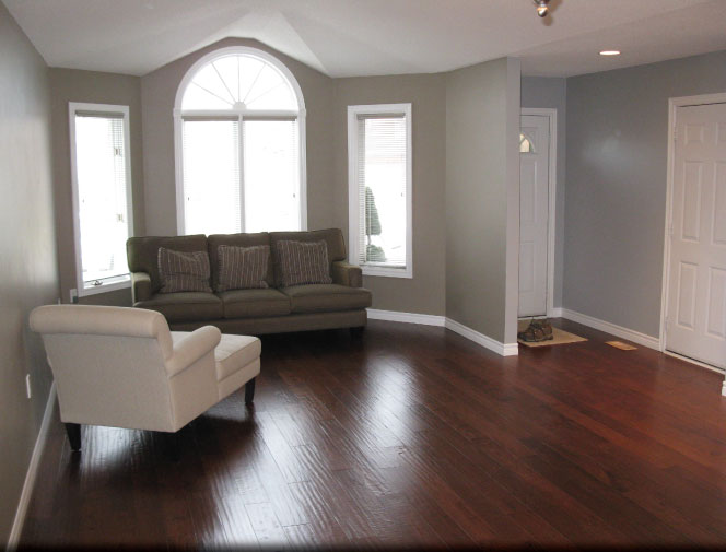 Flooring with new baseboards installed.