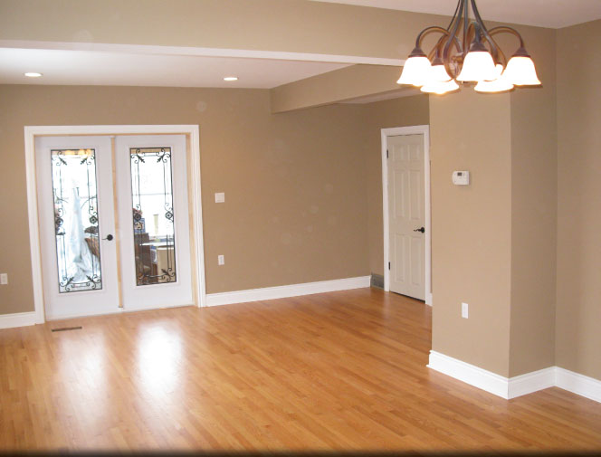 Floor was patched, sanded and refinished. New doors, trim & paint.